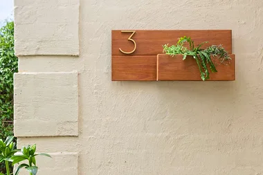 Adam makes a house number planter