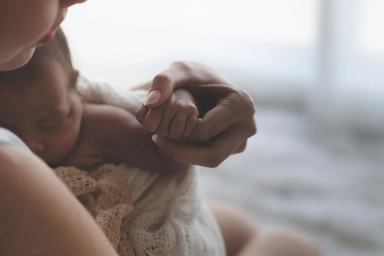 A mother with a newborn baby.