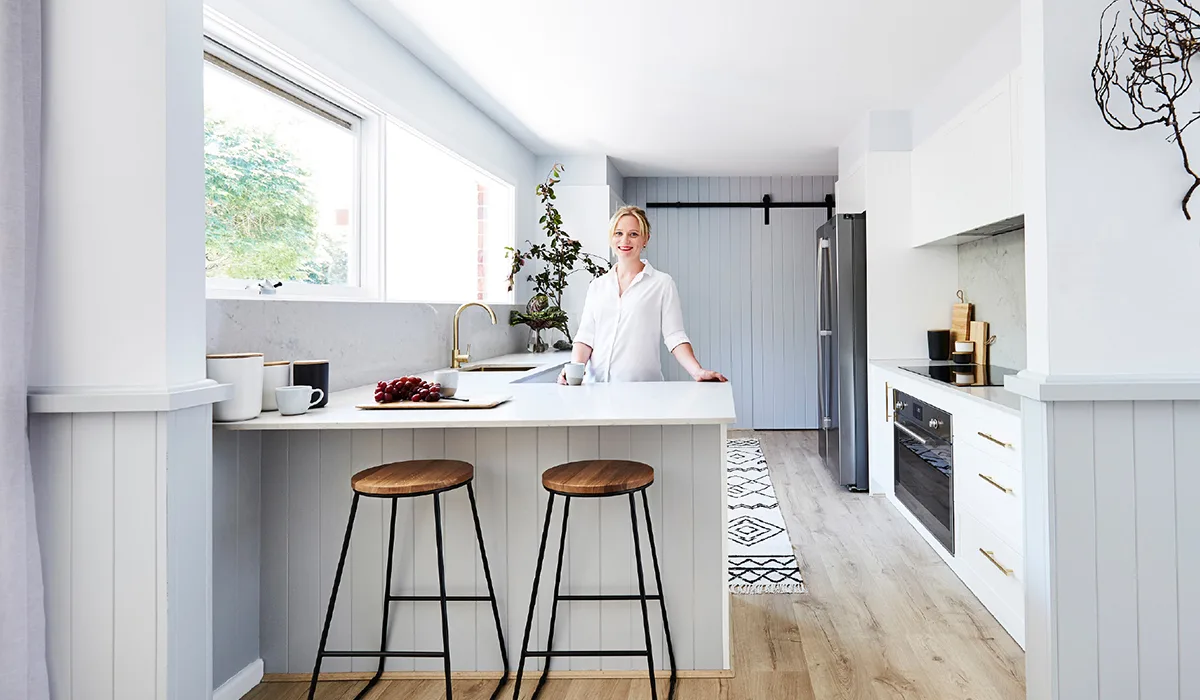 Jen Bishop standing in her renovated kitchen