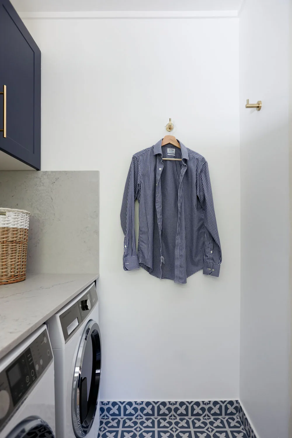 Blue shirt hanging up in renovated laundry