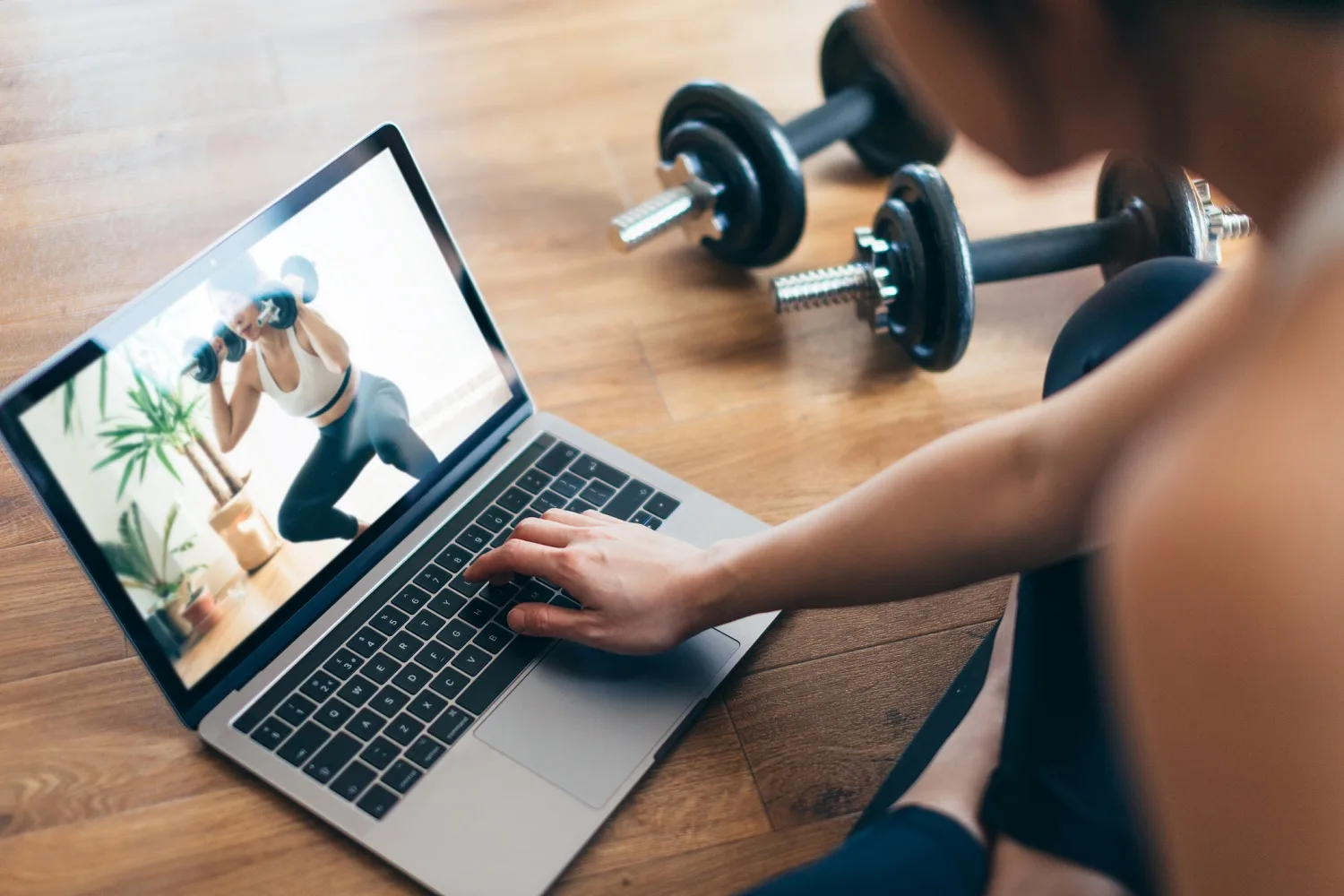 woman working out with laptop guide