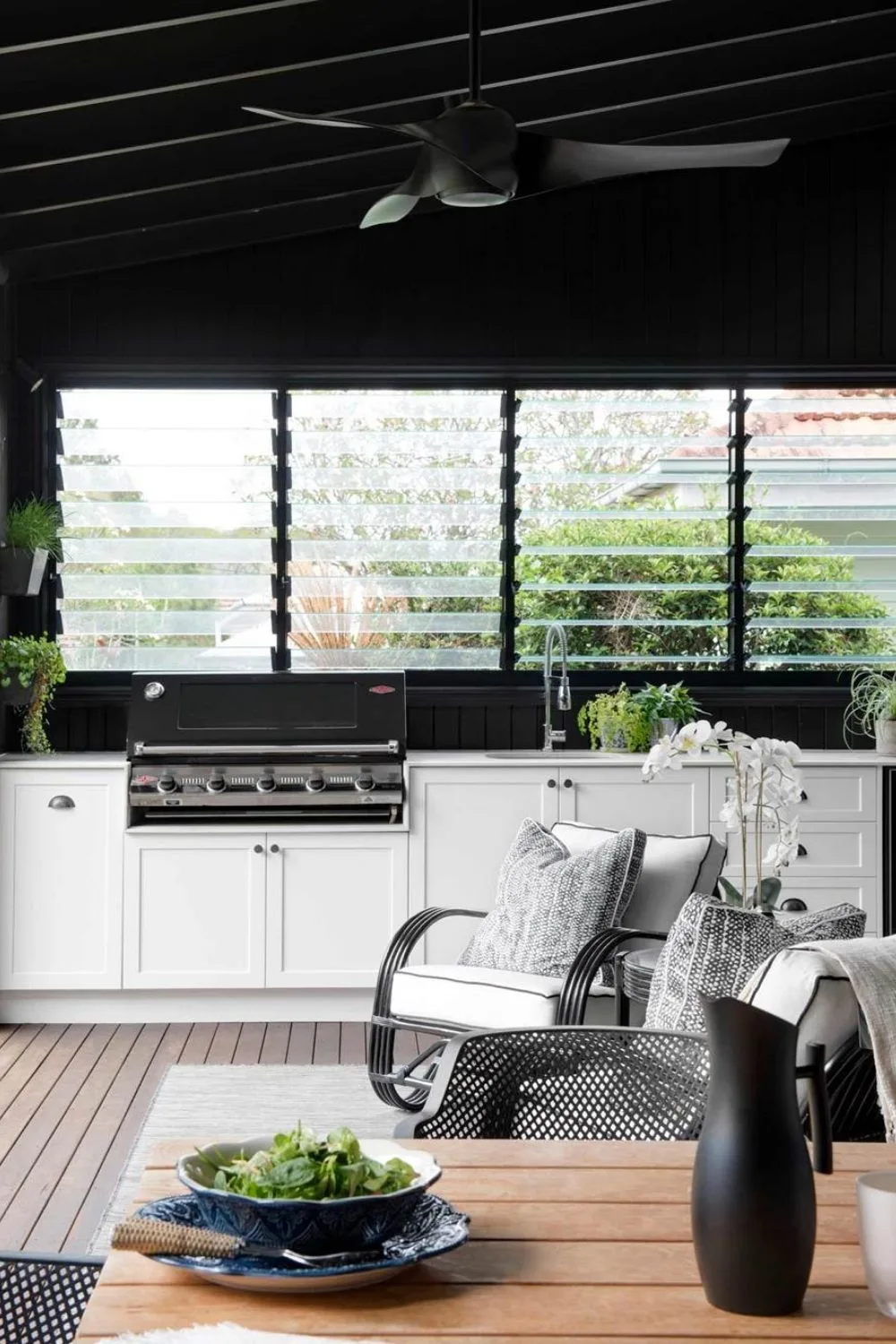 outdoor kitchen with black splashback