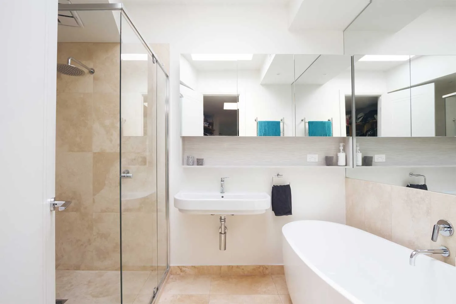 Clean bathroom with chrome fixtures and mirrored cabinet