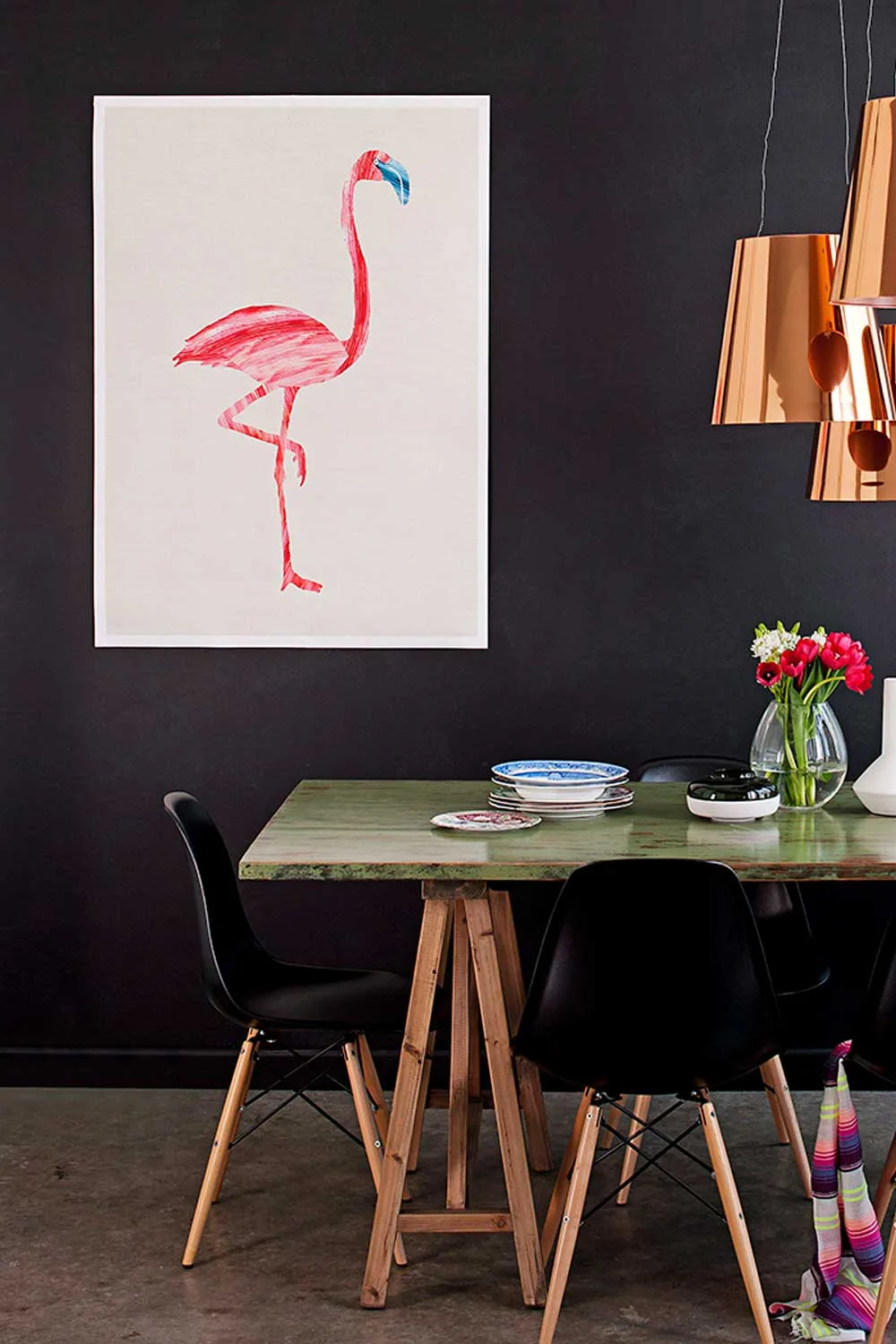 Dining room with pink flamingo wall art