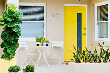 Home entryway with yellow front door