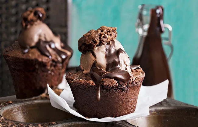 Chocolate muffin with chocolate ice cream and sauce