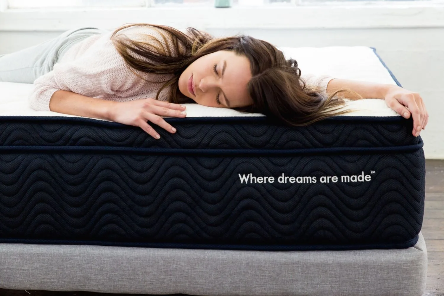 Woman sleeping on a SleepRepublic mattress-in-a-box