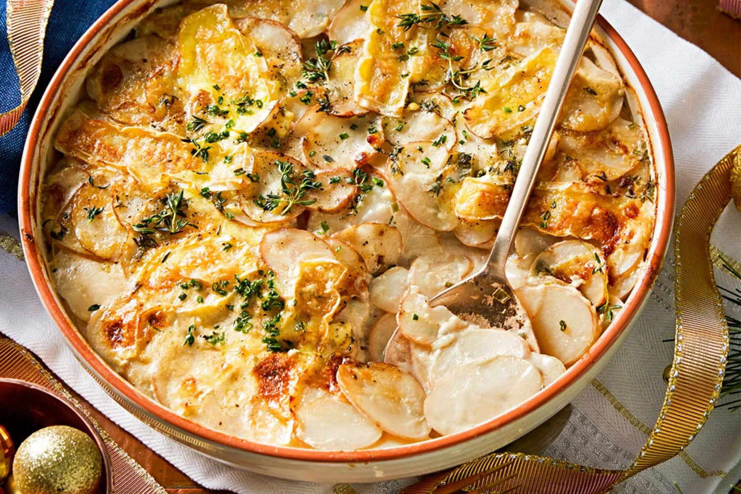 Potato bake with sour cream, brie cheese and chives