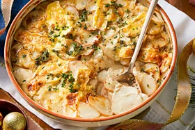 Potato bake with sour cream, brie cheese and chives