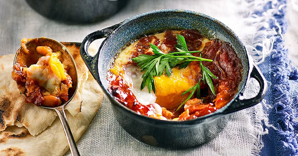 Spanish-style baked eggs with chorizo and smoky beans - Better Homes & Gardens Australia