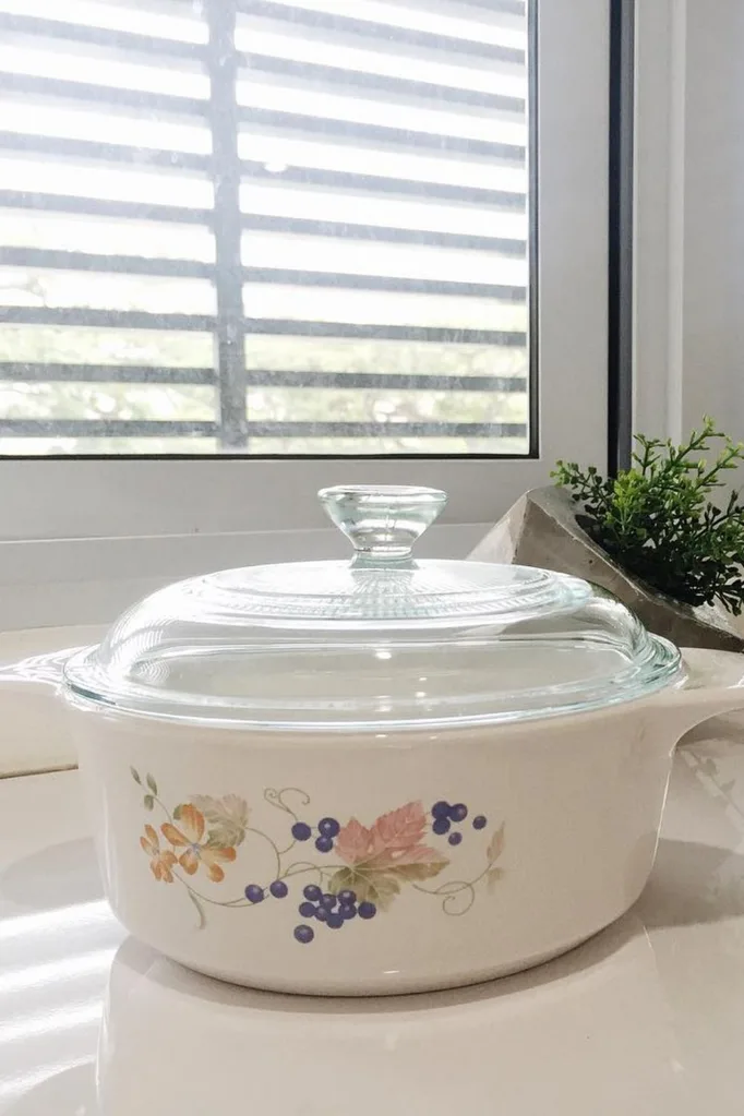 corningware pot on window sill