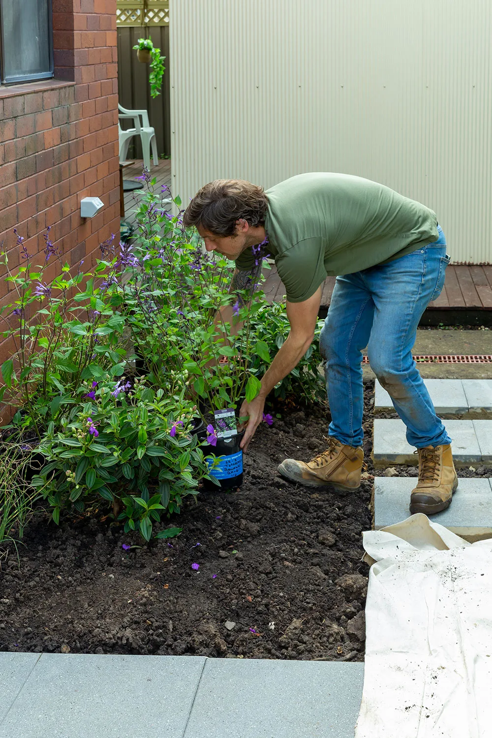 Charlie planting plants