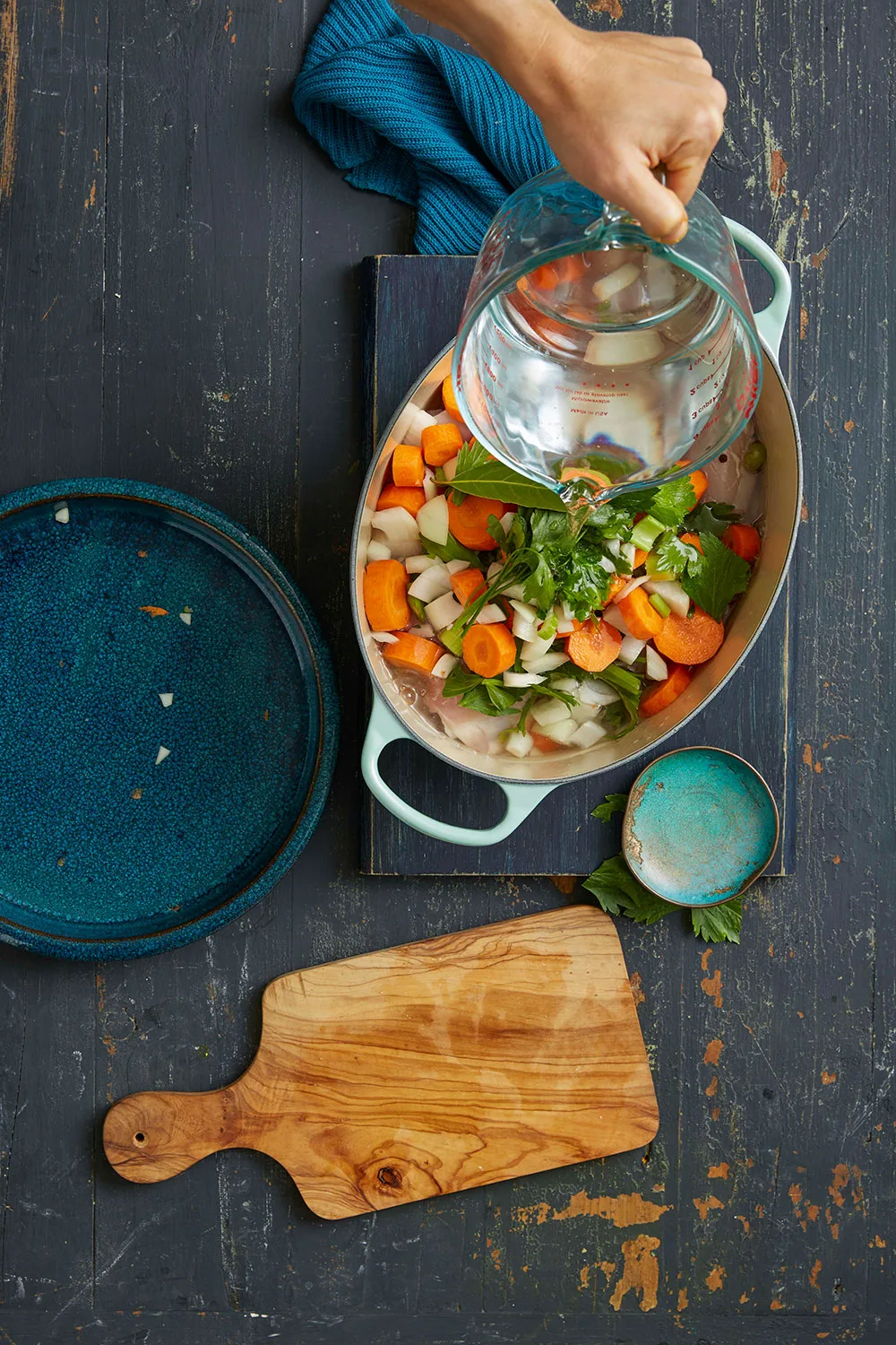 Add water to saucepin filled with vegetables and chicken