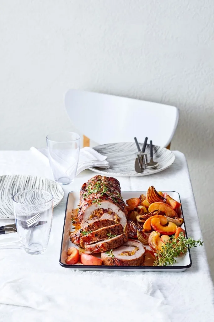 Fruit stuffed pork roast with apple sauce