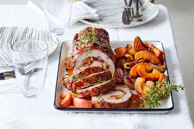 Fruit stuffed pork roast with apple sauce