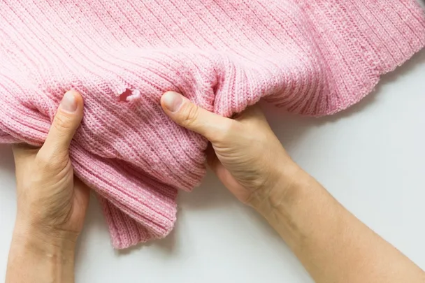 holes in pink jumper