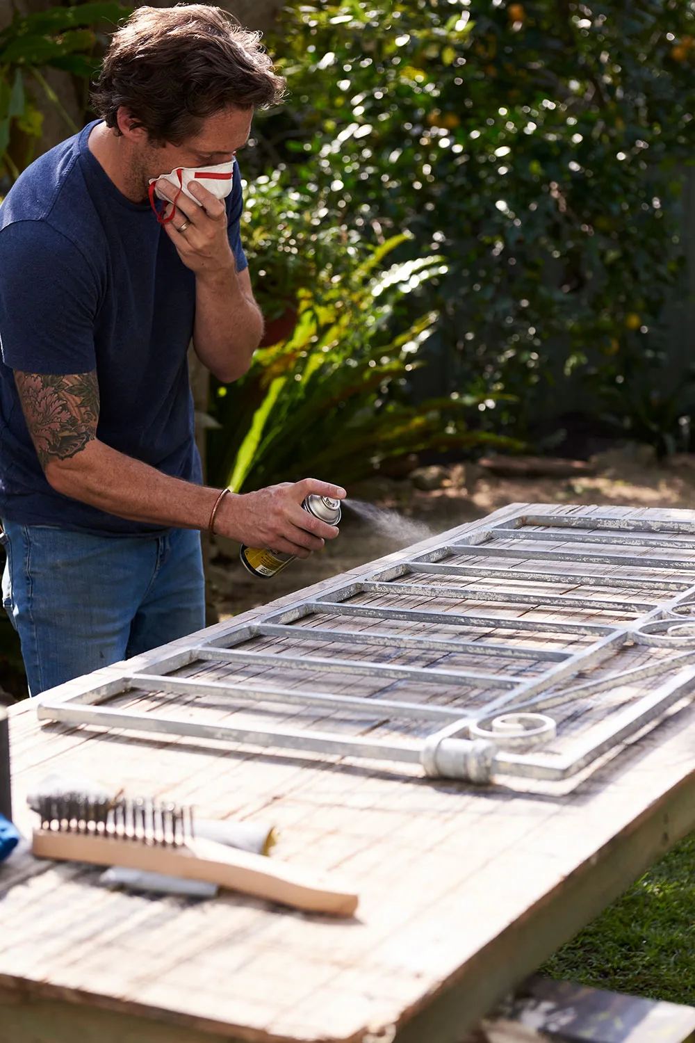 Charlie Albone spray painting gates