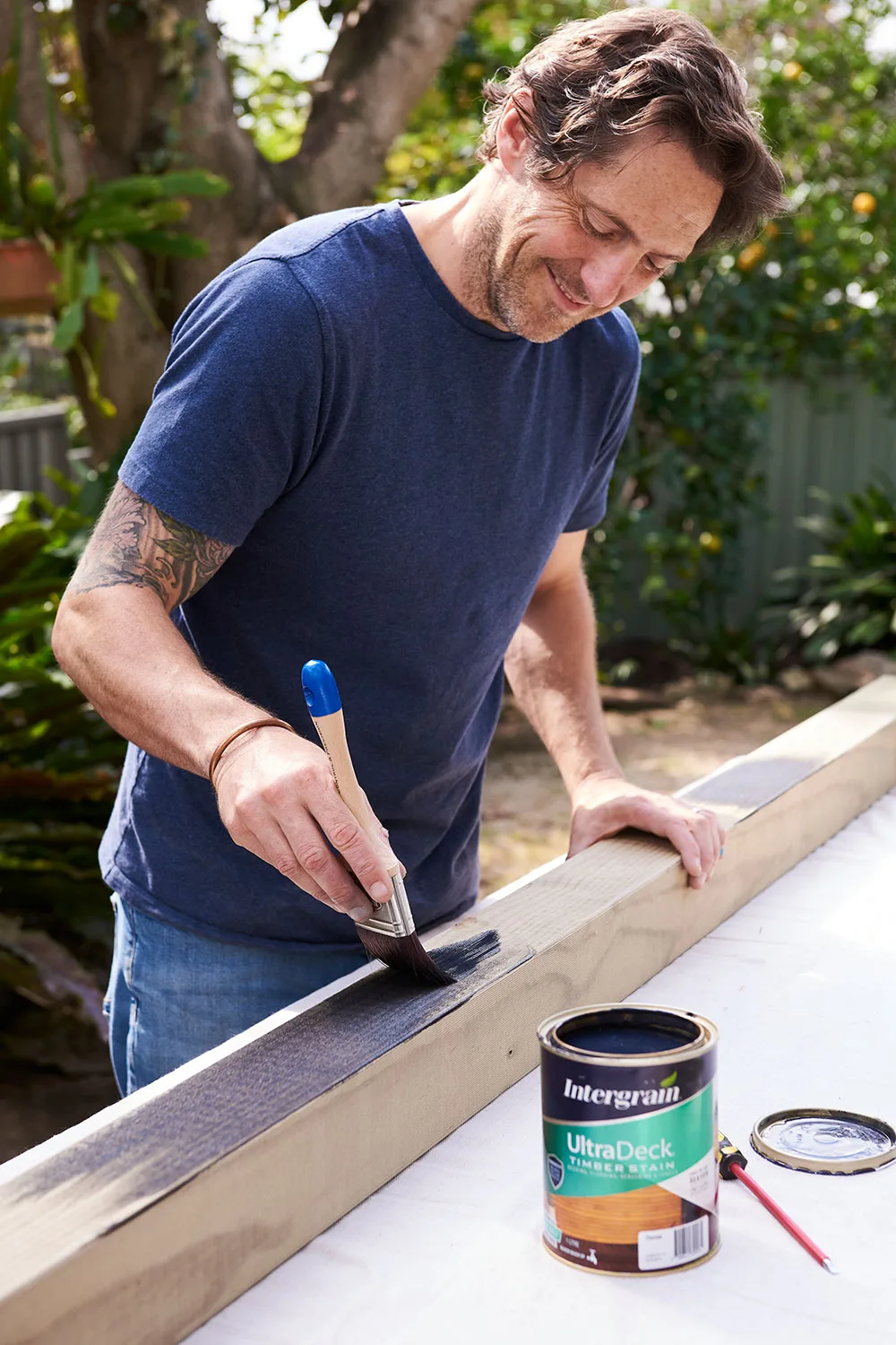 Charlie Albone painting trellis