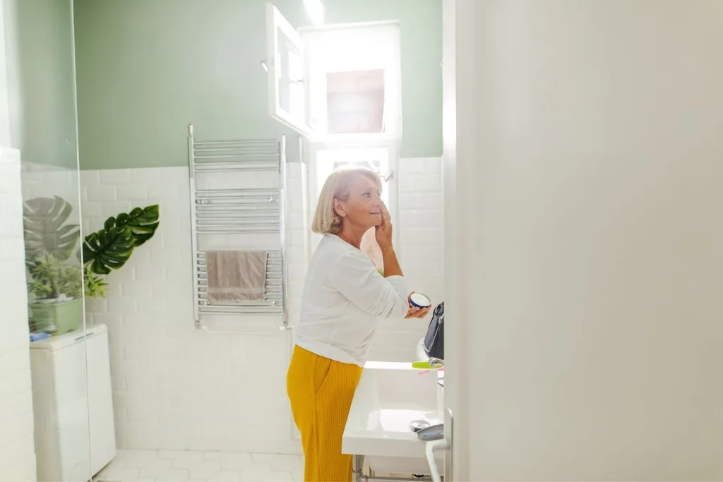 woman applying cream
