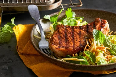 Spiced pork with apple and wombak salad