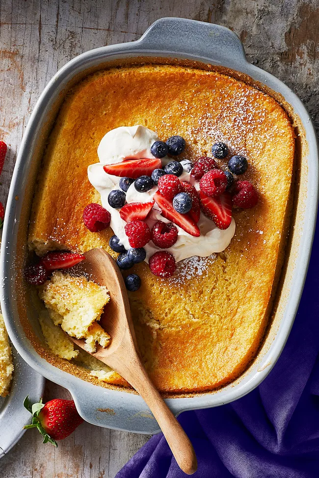 lemon dessert recipes lemon fluff cake with spoon coming out of it