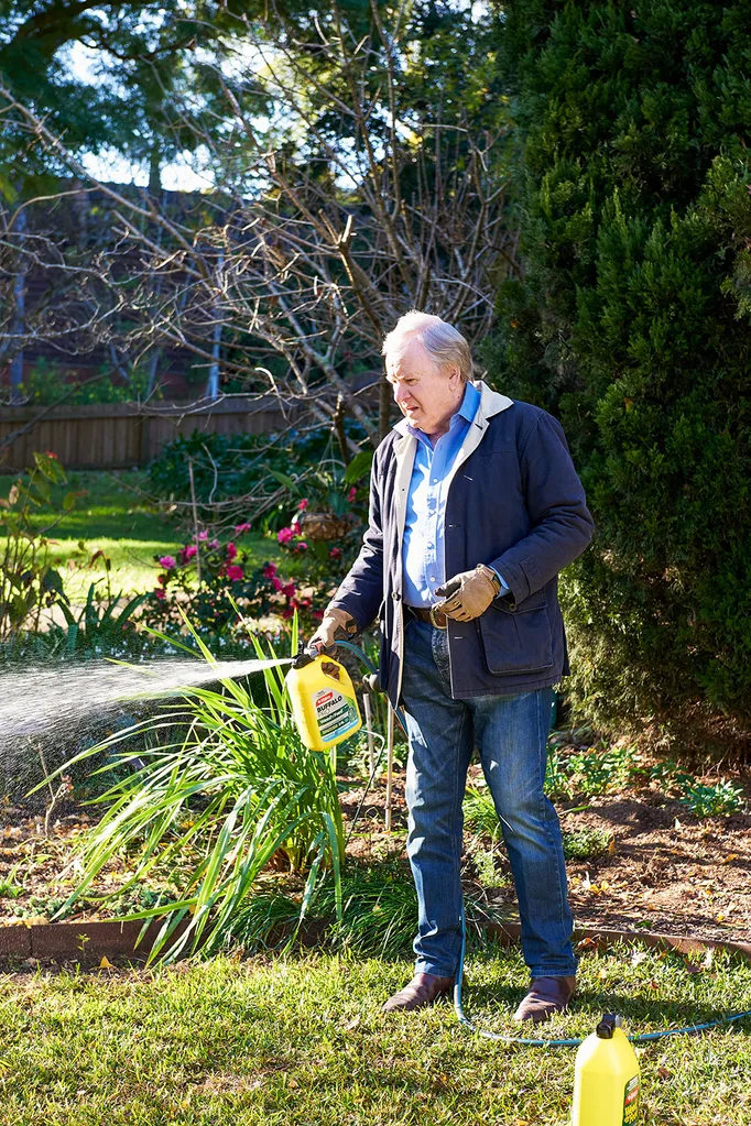 Graham Ross watering lawn