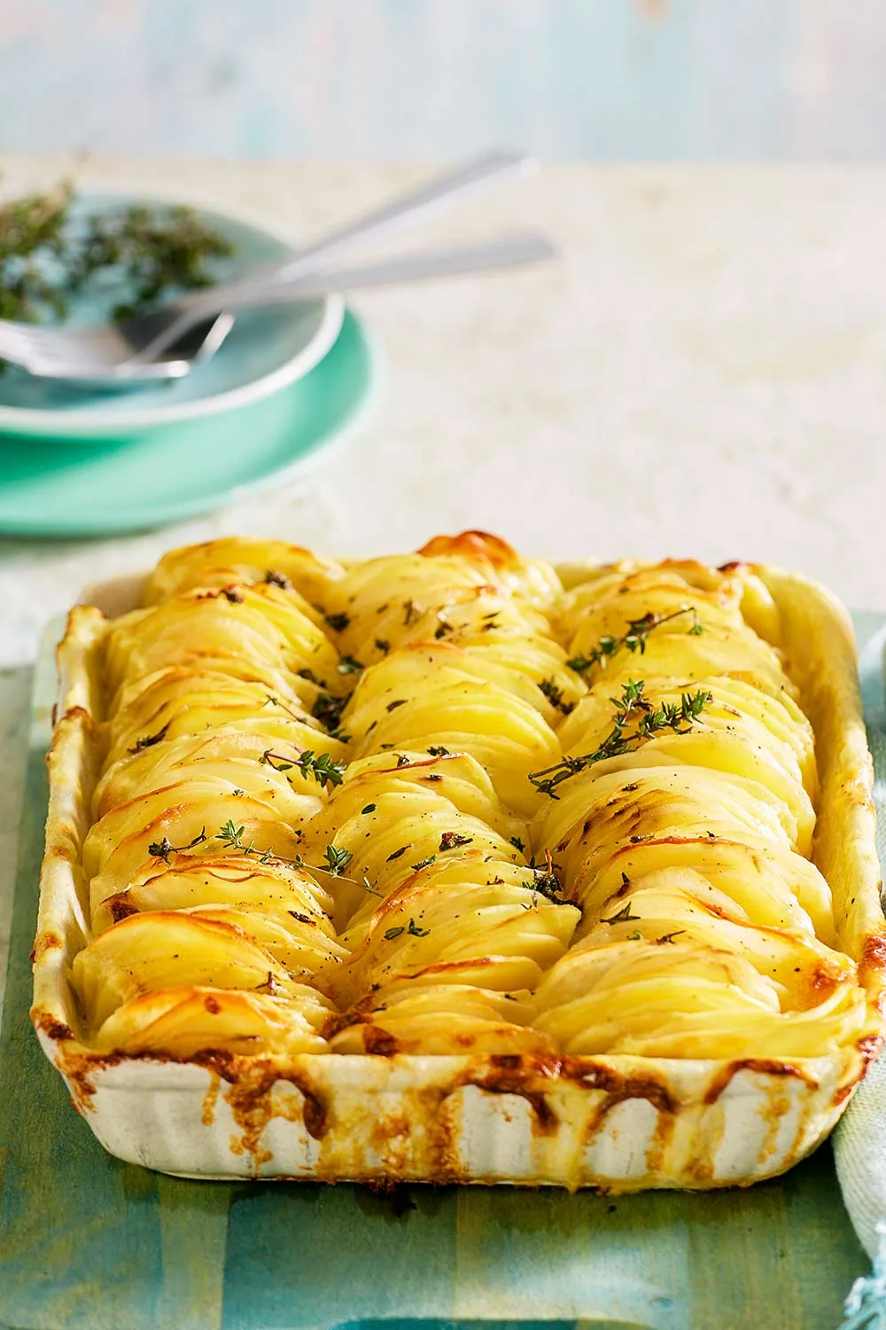 With its crispy top and creamy base, this cheesy potato bake recipe features the ultimate balance of cheese and herb flavours. It's the perfect side dish and one of our most popular recipes.