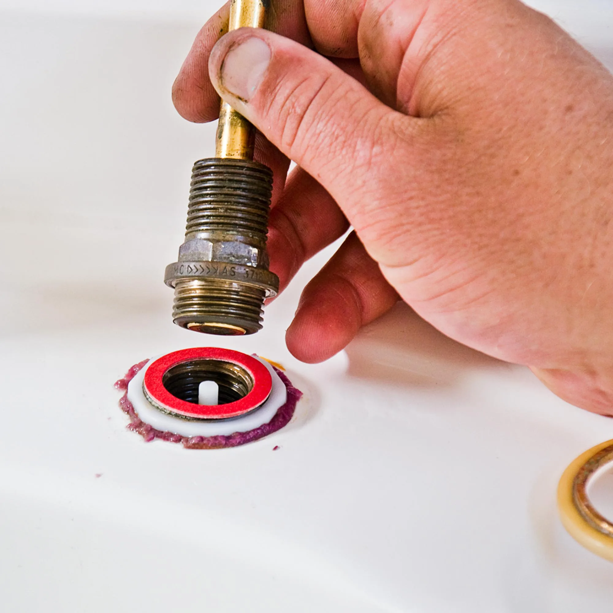 After replacing the O-ring and bottom washer, you can re-assemble the tap and wind it back on, tightening with a spanner.