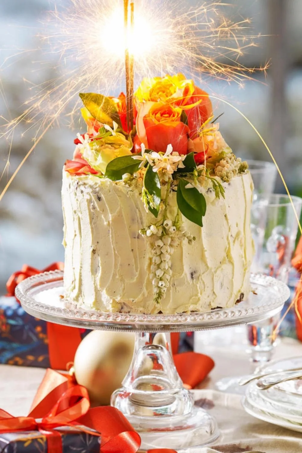 Christmas fruitcake with sparkler in it and icing on outside 