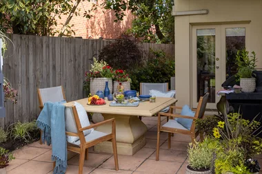 Adam and Melissa clean up a courtyard for entertaining