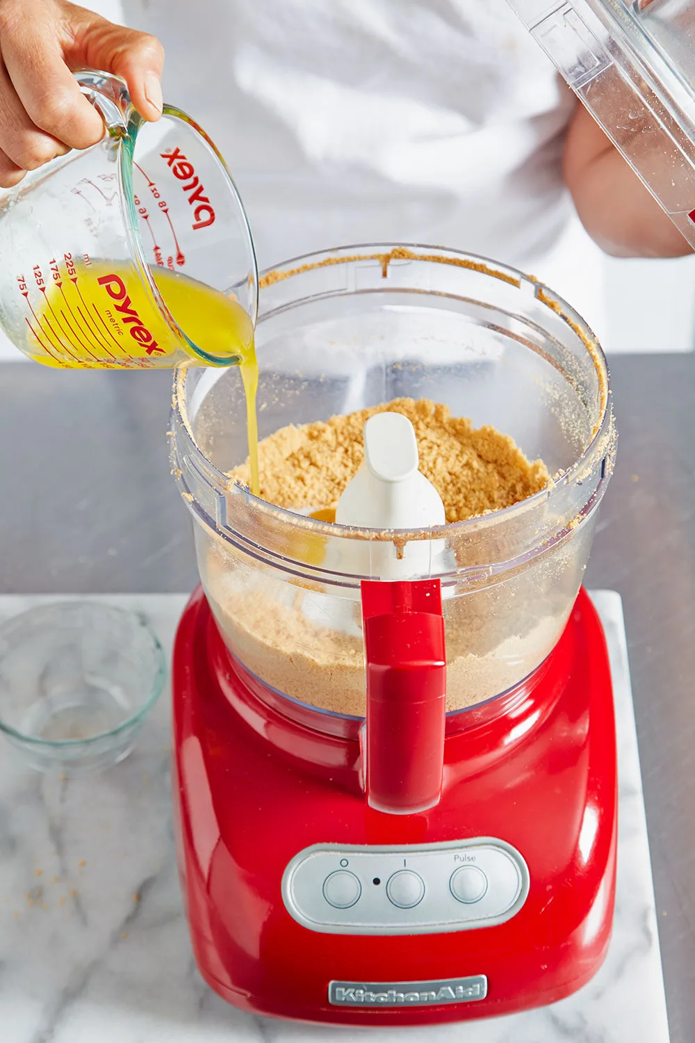Pouring butter into mixer