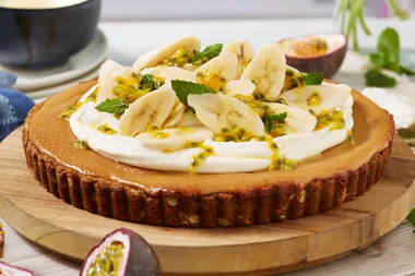 Anzac caramel tart with banana and passionfruit