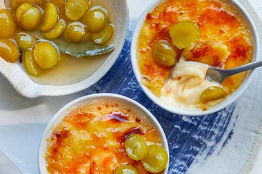 Caramelised rosemary and cardamon custards with grappa-spiked plums