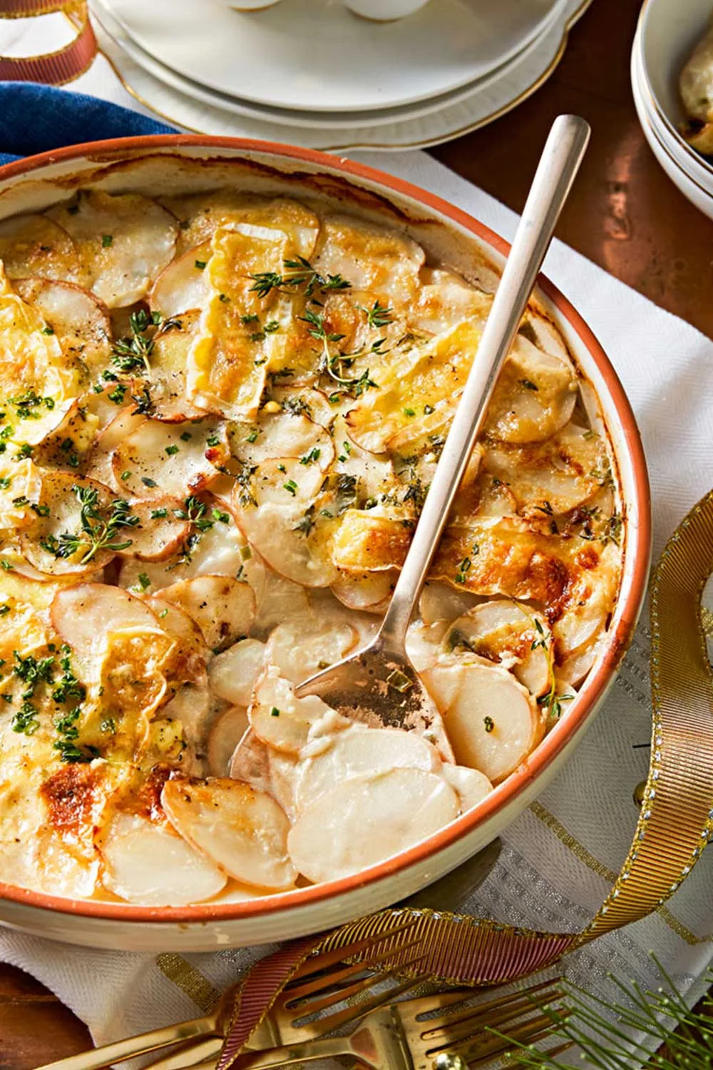 Potato bake with sour cream, brie cheese and chives