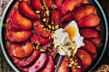 Upside-down plum cake with honeyed pears