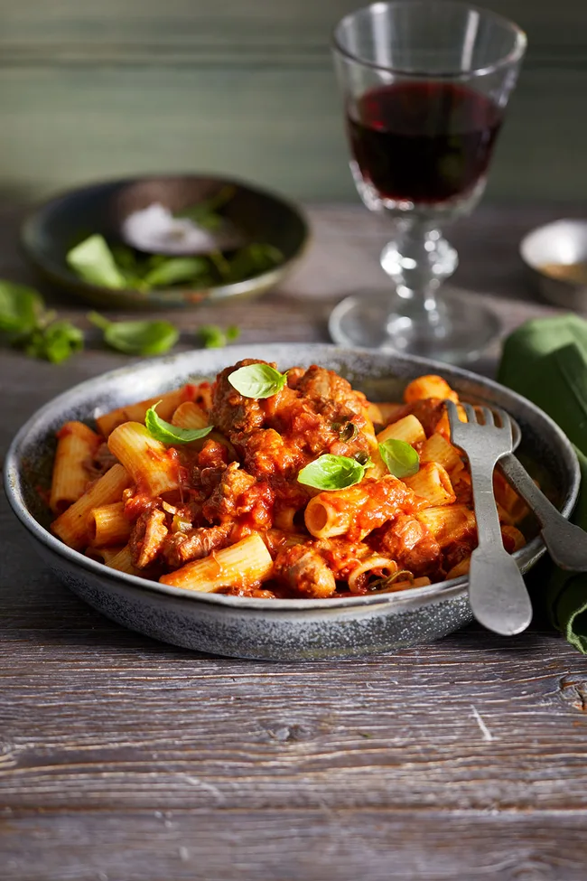 Beef ragu with basil on top made with chuck steak