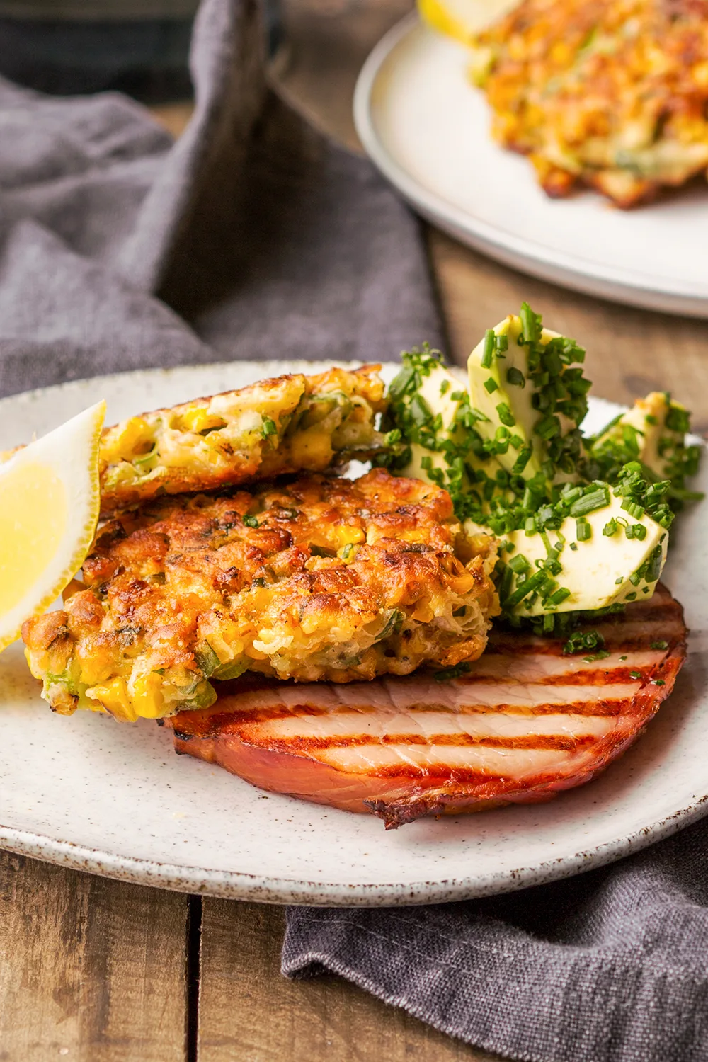 serrano ham thick cut with chive avocado and fritters on top 