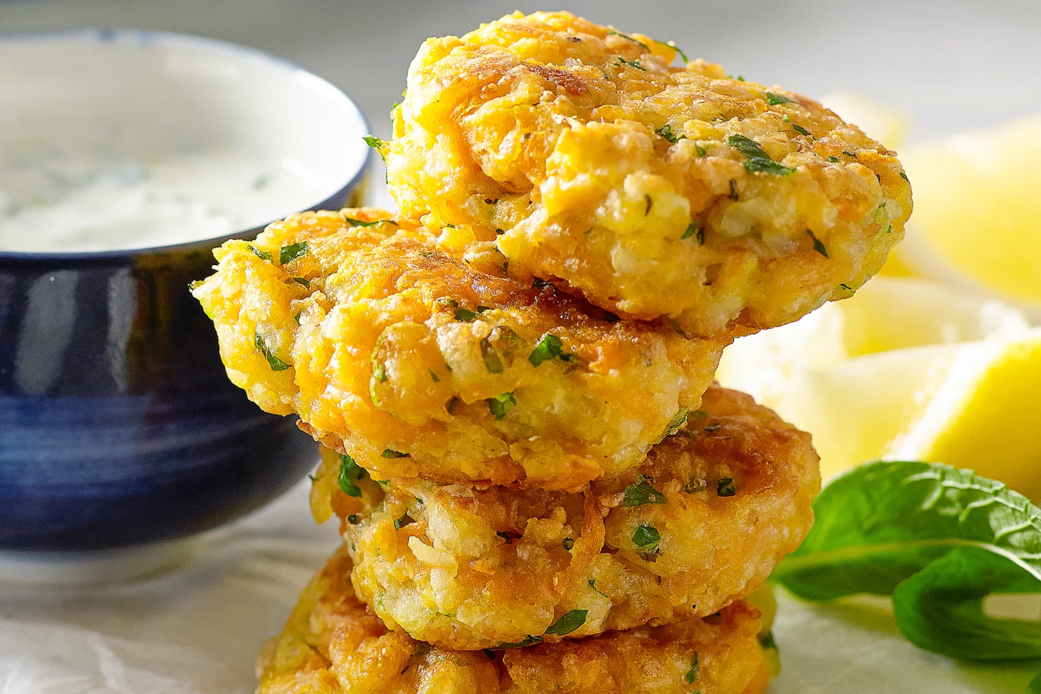 Mini haloumi and sweet potato fritters with lemon and mint dipping sauce