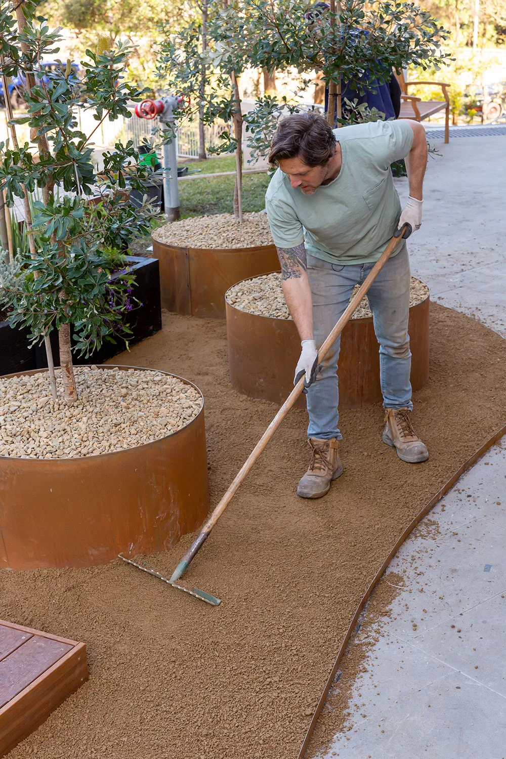 Charlie Albone raking gravel