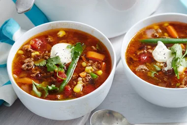Mexican beef chilli soup in a white bowl