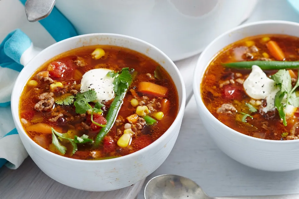 Mexican beef chilli soup in a white bowl