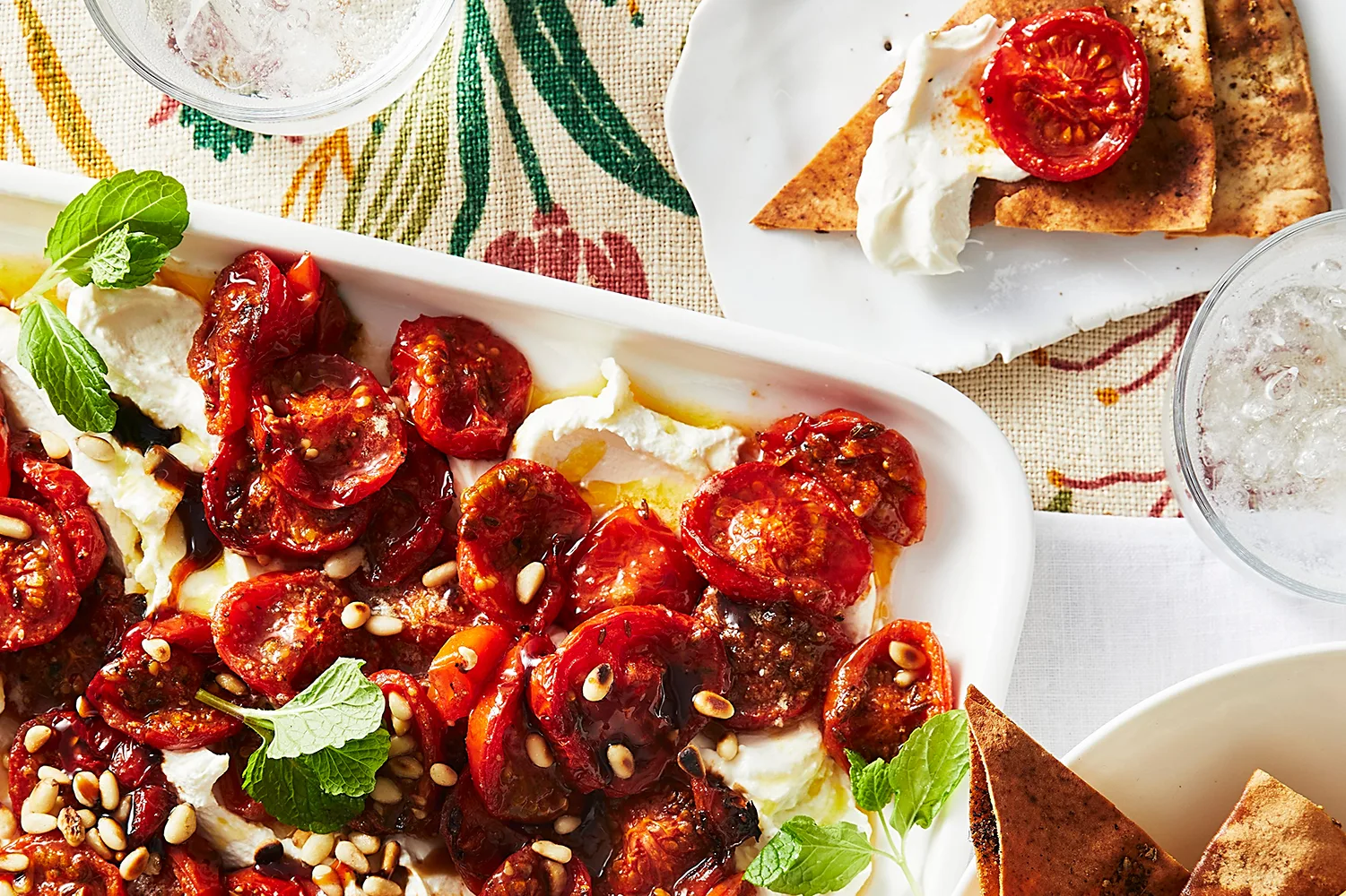 Warm slow-roasted tomatoes with labne and zaatar bread