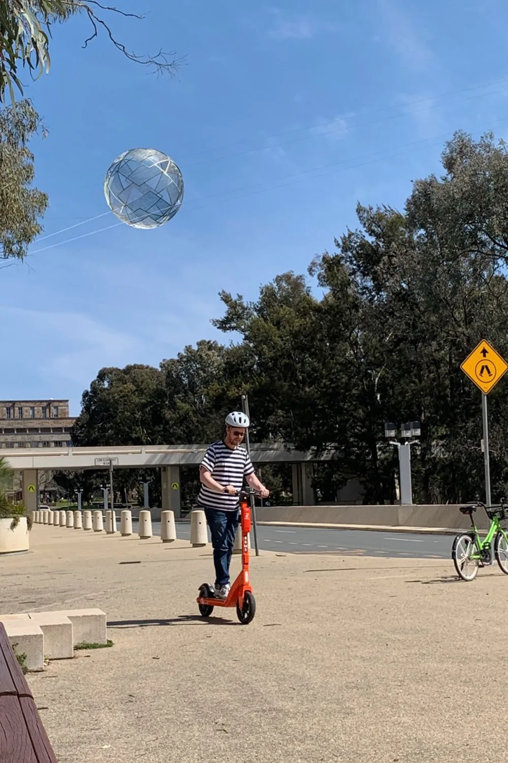 Man riding scooter outside NGA