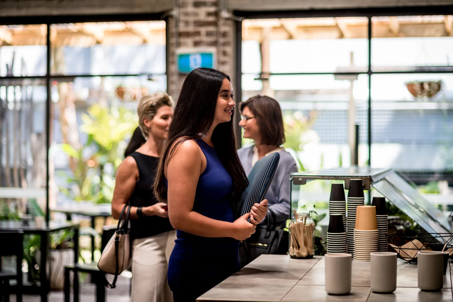 women in coffee queue