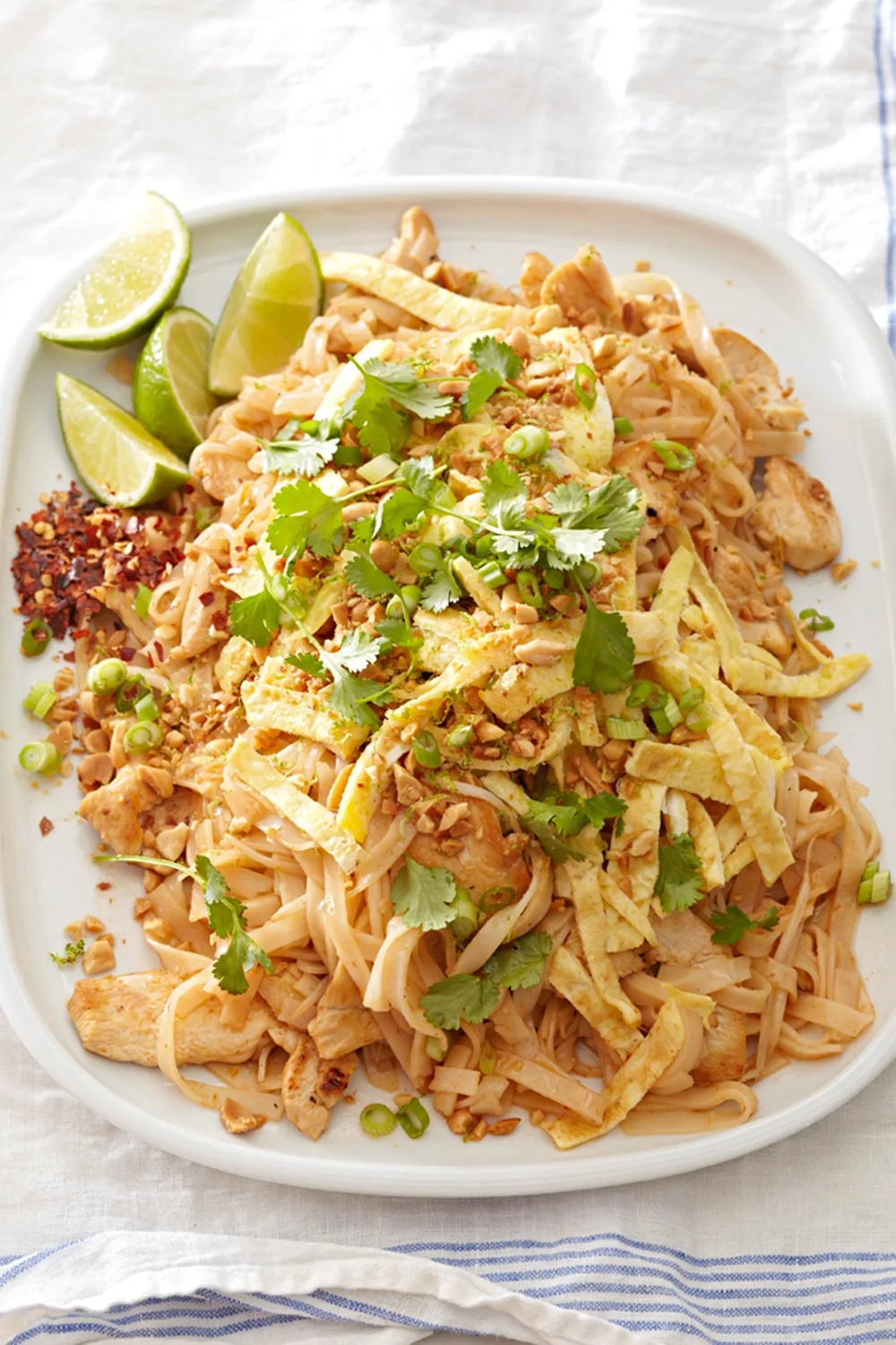 Leftover barbecue chicken pad thai with coriander sprinkled on top