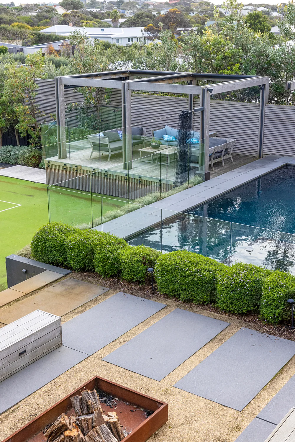 Keep the colours of a coastal yard muted to fit in with your environment.