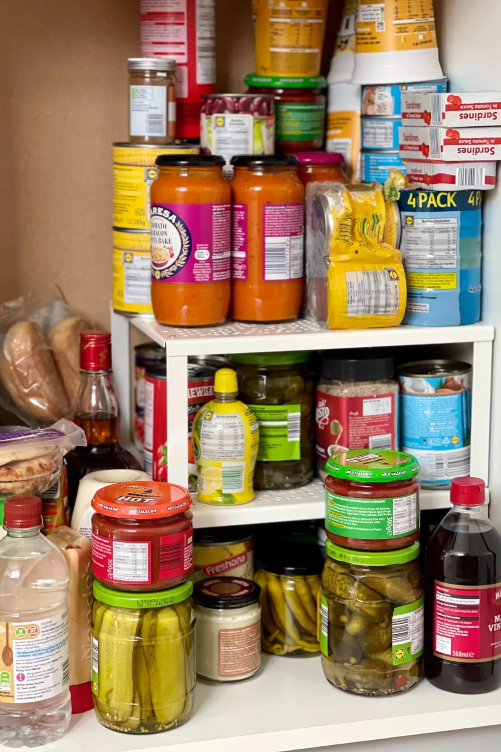 Getting rid of expired cans, jars and spices helps declutter your kitchen cupboards.