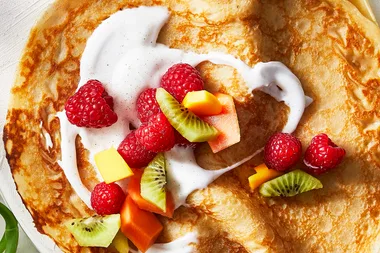Lime crepes with summer fruit and coconut
