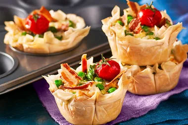 Little filo tarts with goat’s cheese, peas and crispy pancetta