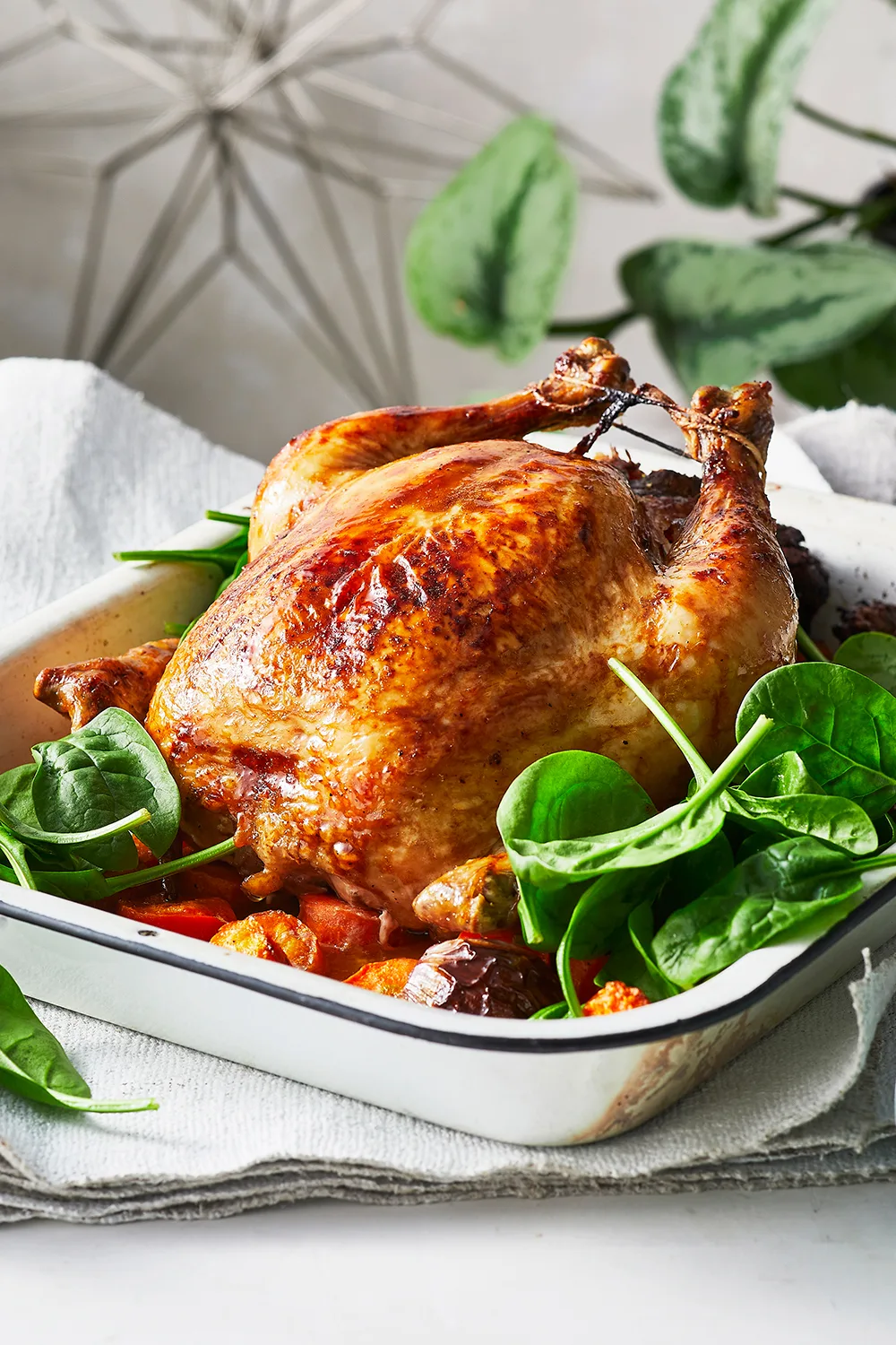 Cheesymite chicken with spinach surrounding it